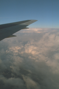 Some clouds with a wing