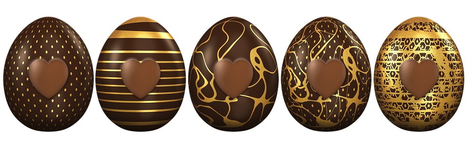 Several designs of chocolate easter eggs with gold decor