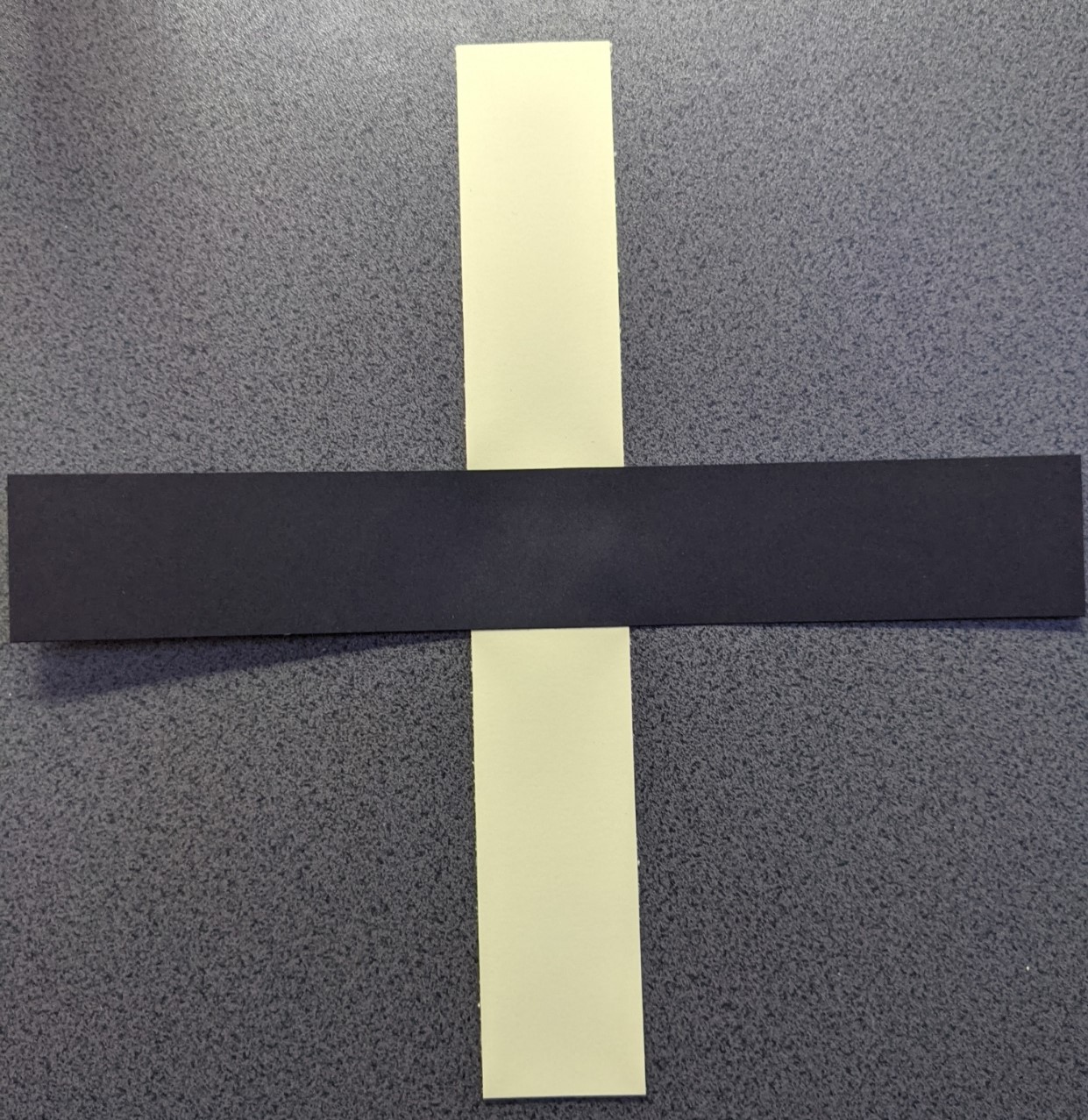Two strips of card glued at their centres to form a cross