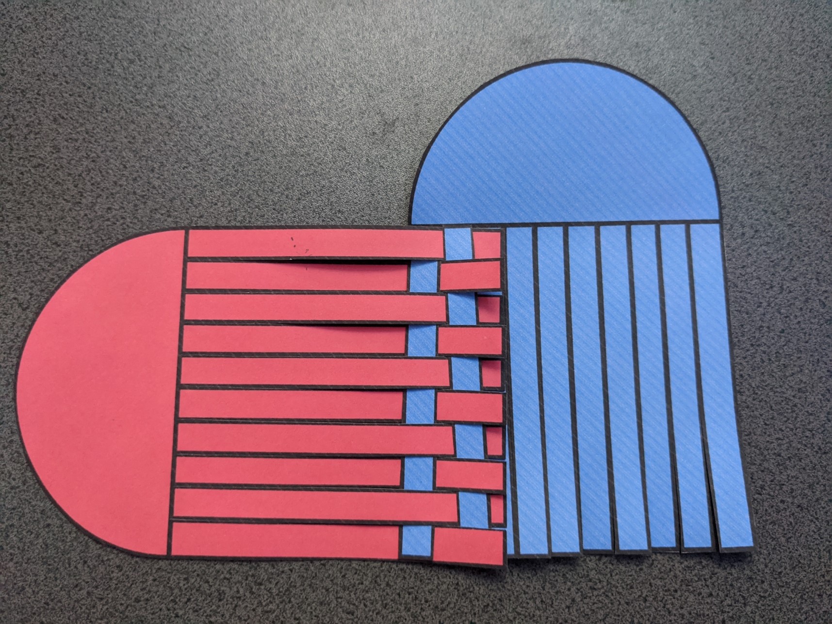 the heart templates after the second blue strand has been woven across the red