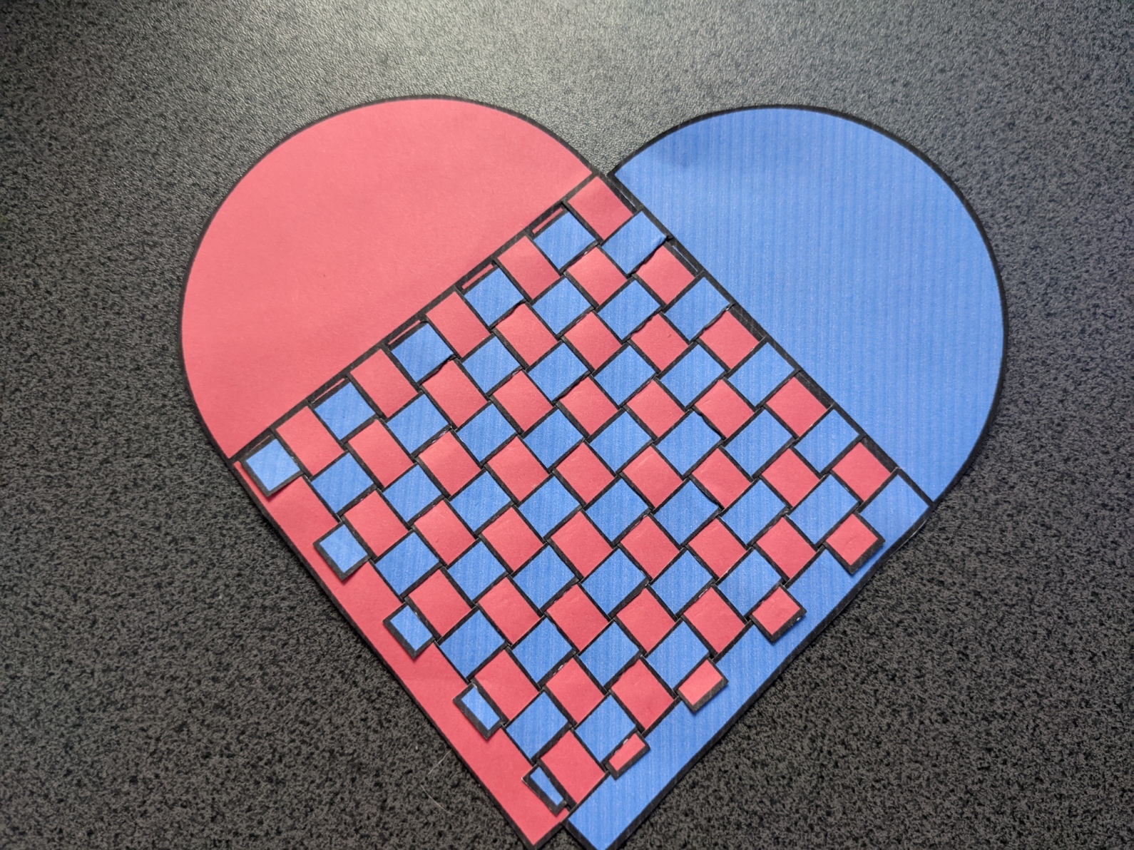 a completed woven heart design
